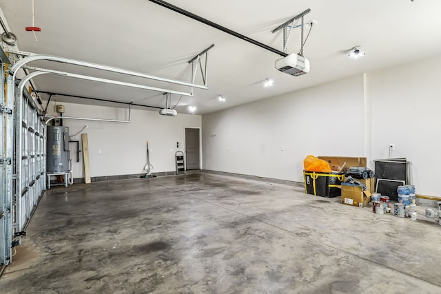 garage featuring water heater and a garage door opener