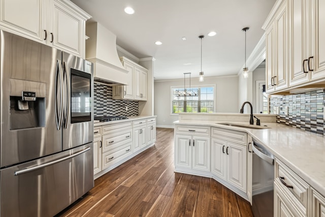 kitchen with stainless steel appliances, dark hardwood / wood-style floors, decorative backsplash, hanging light fixtures, and premium range hood