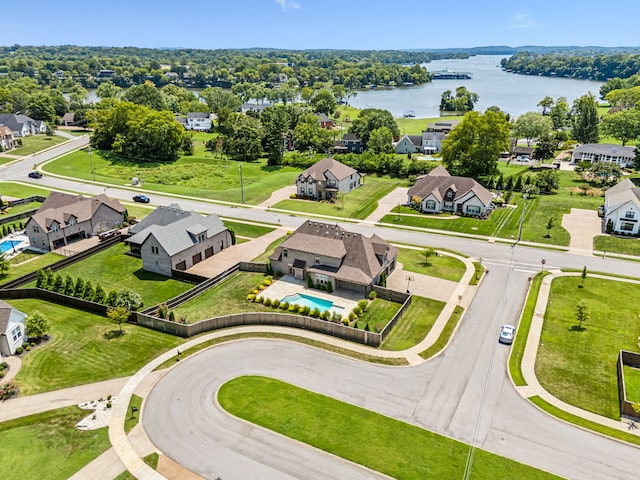 birds eye view of property featuring a water view