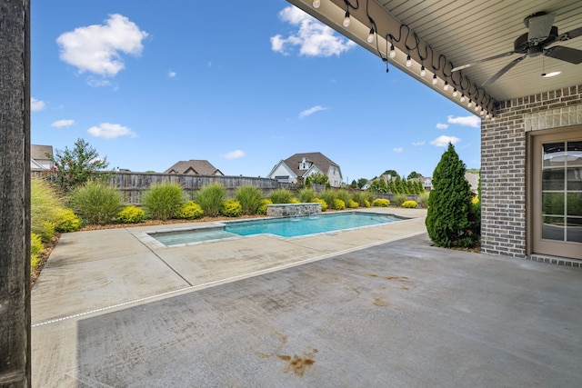 view of pool featuring ceiling fan and a patio area