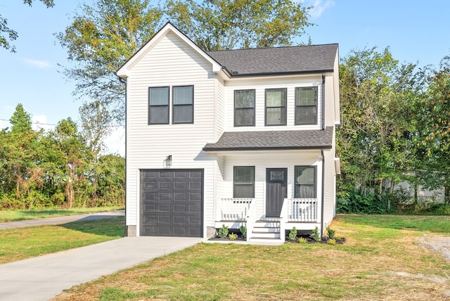 view of front of house featuring a garage, a porch, and a front lawn