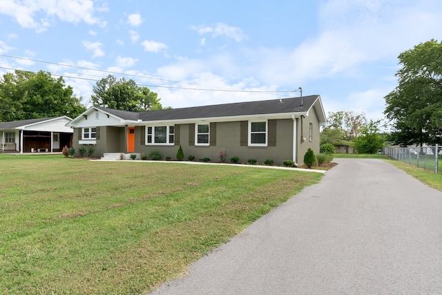 ranch-style house with a front yard