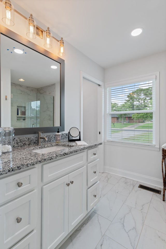 bathroom featuring vanity and tile patterned flooring