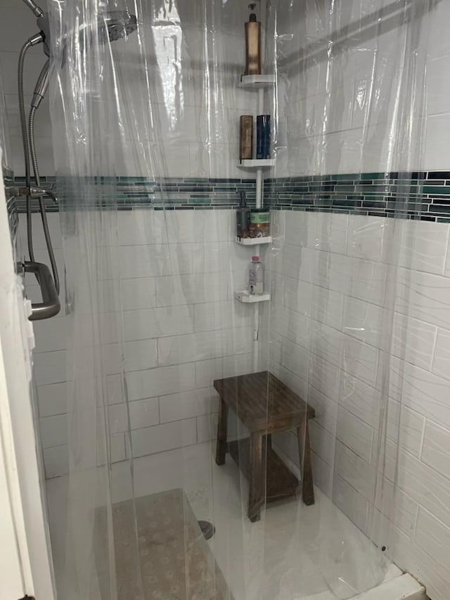 full bathroom featuring a stall shower