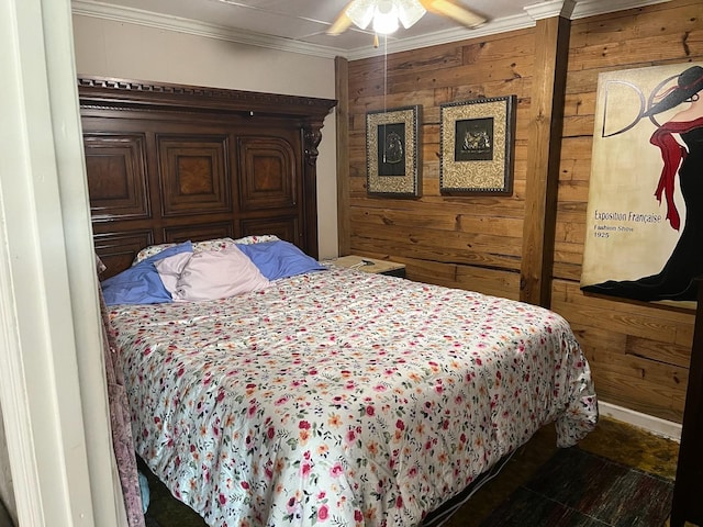 bedroom with crown molding, ceiling fan, and wood walls