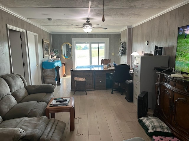 office space featuring ceiling fan, ornamental molding, and light wood-type flooring