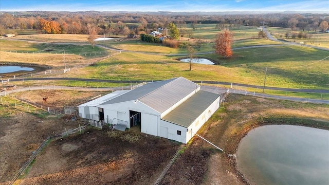 birds eye view of property with a rural view