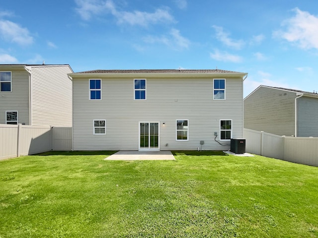 back of property featuring cooling unit, a lawn, and a patio