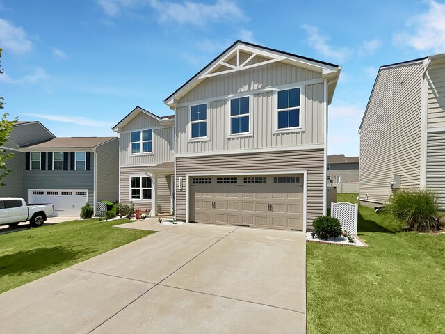 view of front of property with a front lawn and a garage