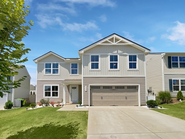 view of front of property featuring a front lawn and a garage