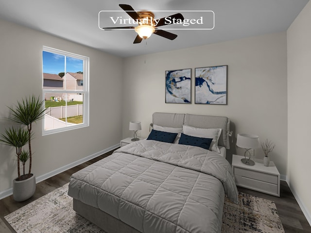 bedroom featuring ceiling fan and dark hardwood / wood-style flooring