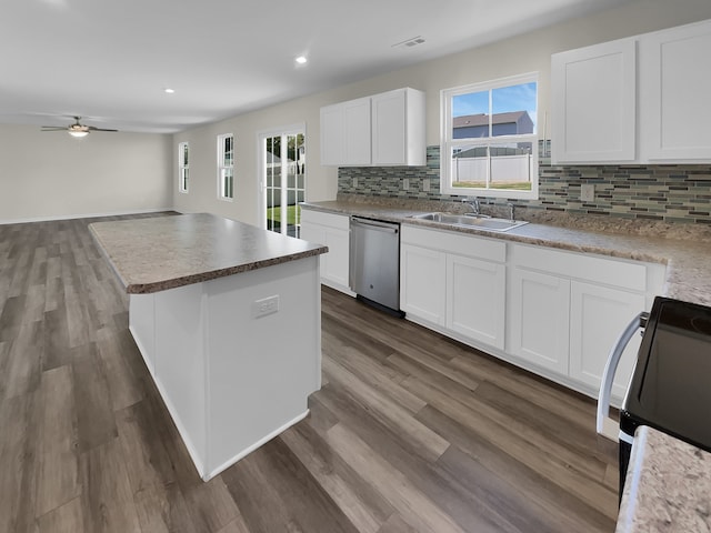 kitchen with ceiling fan, sink, dark hardwood / wood-style flooring, and stainless steel dishwasher