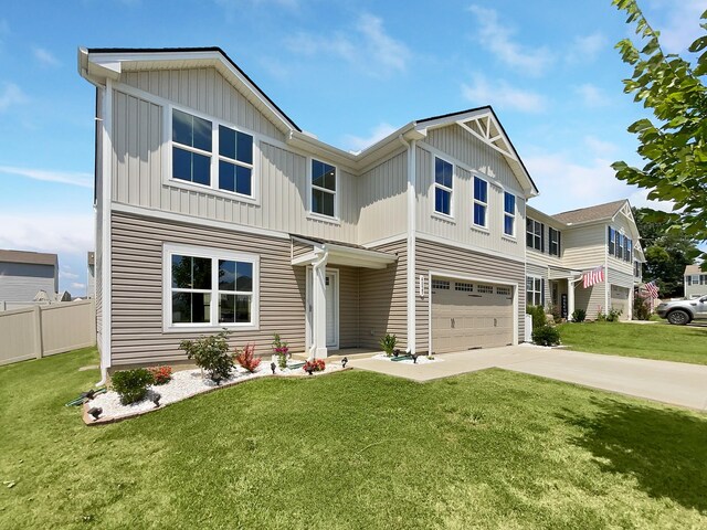 view of front of home with a garage and a front yard