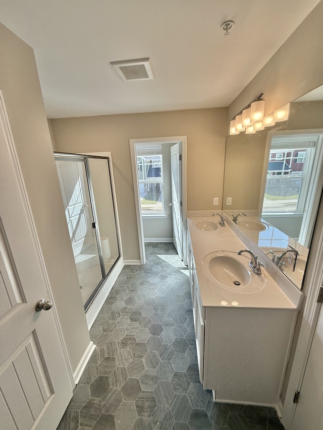 bathroom with vanity and walk in shower