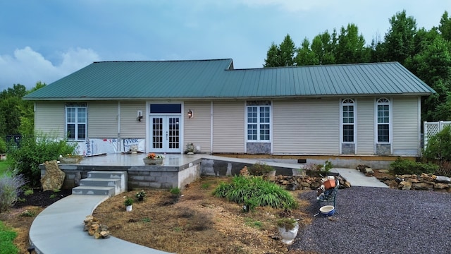 view of front of house featuring french doors and a patio