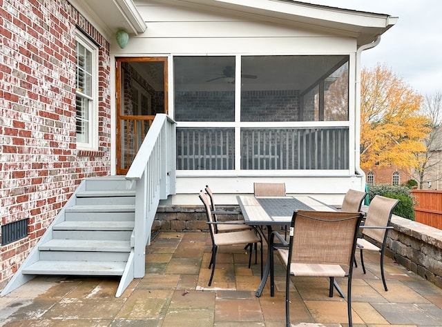 view of patio / terrace featuring a sunroom