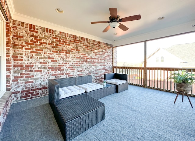 sunroom / solarium featuring ceiling fan