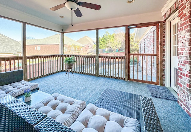 sunroom with ceiling fan