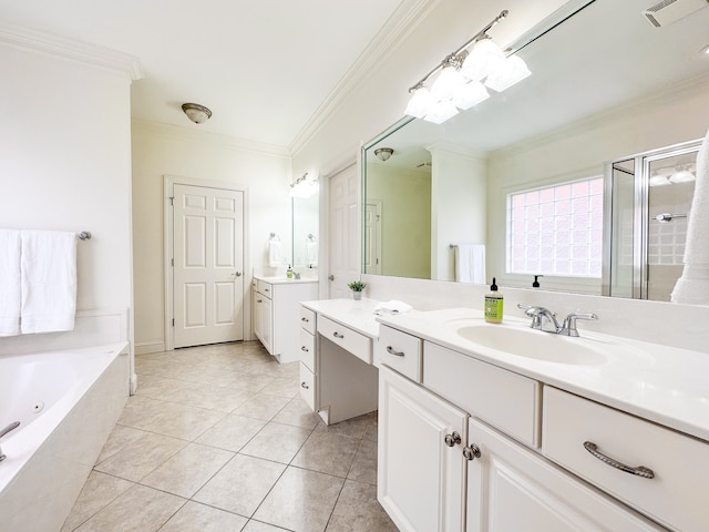 bathroom featuring crown molding, vanity, tiled tub, and tile patterned flooring