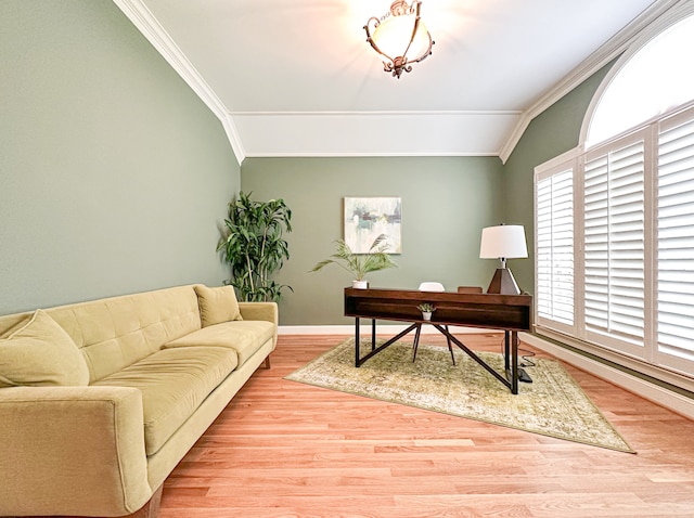 office featuring light hardwood / wood-style flooring, lofted ceiling, and ornamental molding