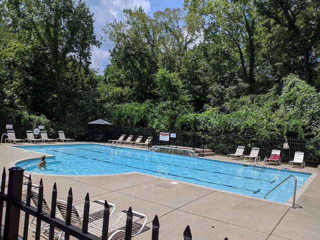 view of swimming pool with a patio area