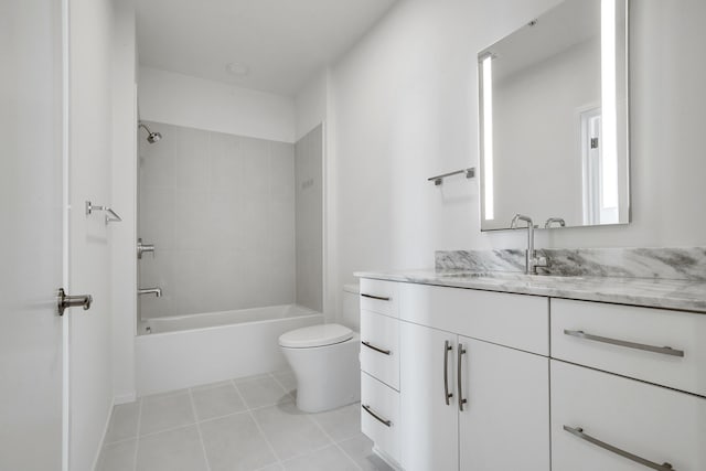 full bathroom with vanity, tiled shower / bath combo, toilet, and tile patterned flooring