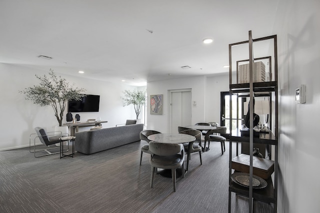 dining room featuring carpet