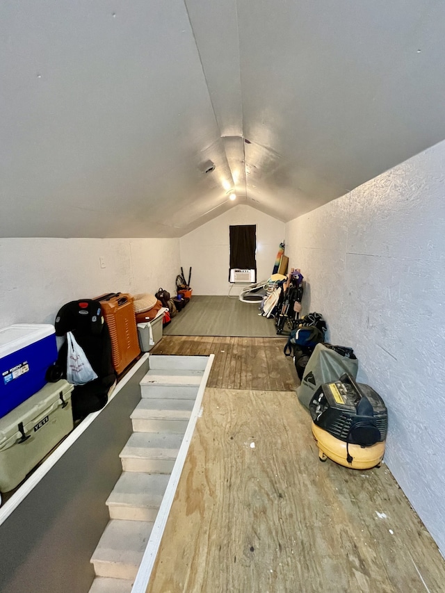 bonus room featuring lofted ceiling and wood-type flooring