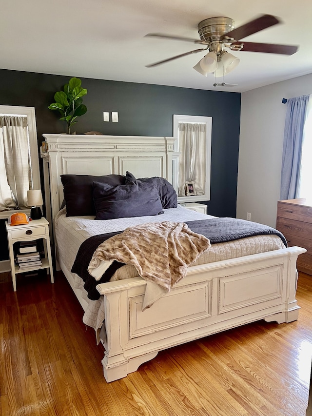 bedroom featuring ceiling fan and hardwood / wood-style flooring