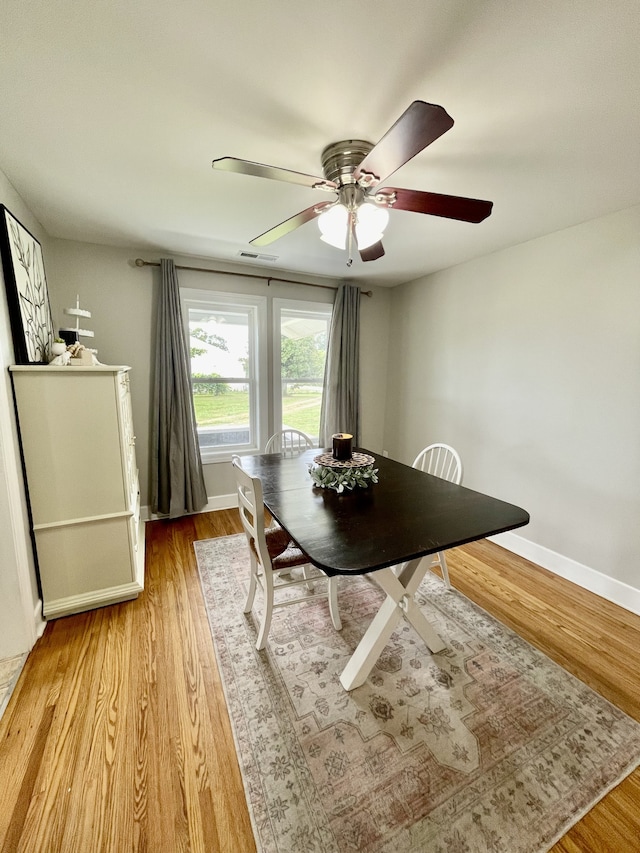 unfurnished dining area featuring light hardwood / wood-style flooring and ceiling fan