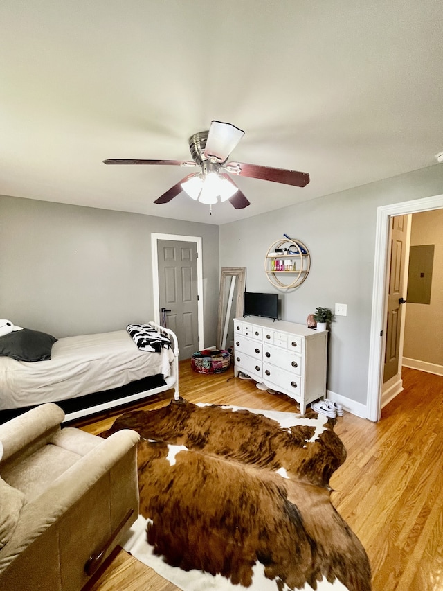 bedroom featuring ceiling fan and light hardwood / wood-style flooring