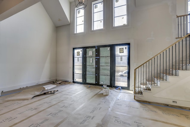 foyer featuring mail boxes and a high ceiling