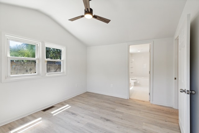 unfurnished room with ceiling fan, light hardwood / wood-style flooring, and vaulted ceiling