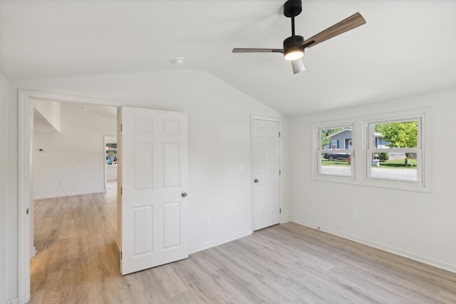 unfurnished bedroom featuring ceiling fan, vaulted ceiling, and light hardwood / wood-style floors