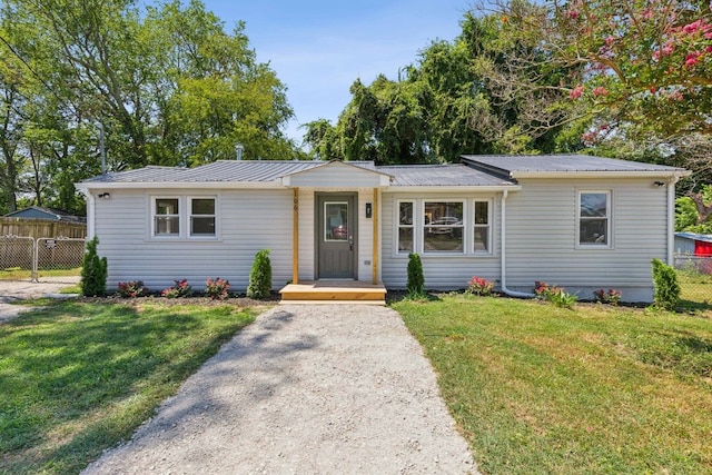 single story home with a front yard