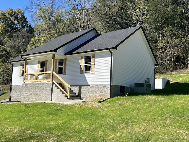 view of property exterior with a lawn and a porch