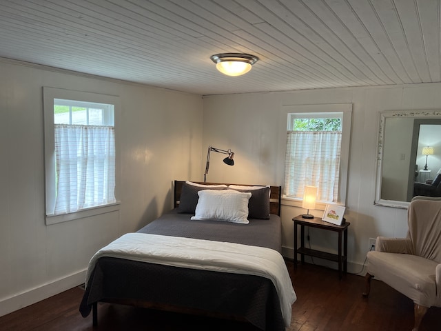 bedroom with wooden ceiling and hardwood / wood-style floors