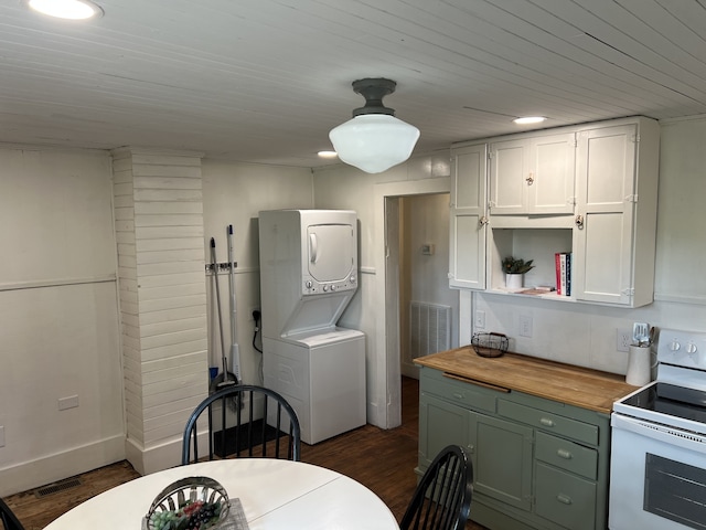 kitchen featuring dark hardwood / wood-style flooring, white electric stove, white cabinets, stacked washer and clothes dryer, and green cabinets