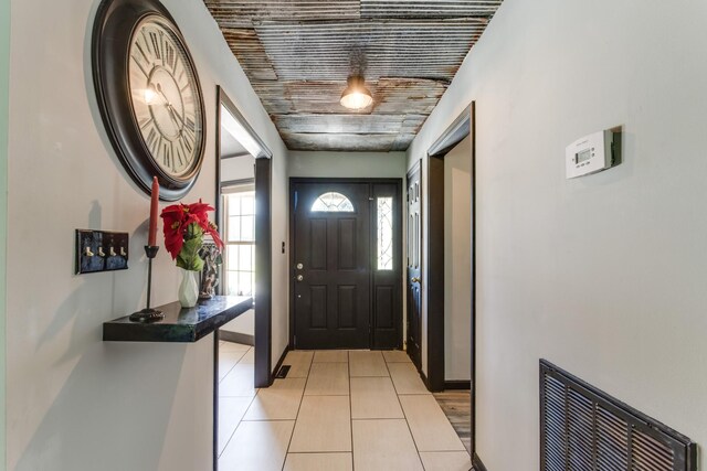 entrance foyer with light tile patterned floors