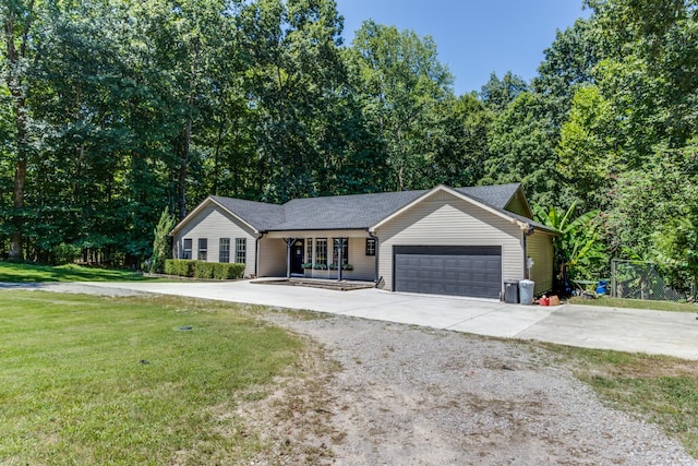 single story home featuring a garage and a front yard