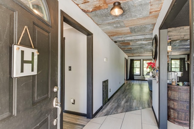 entryway with hardwood / wood-style flooring, vaulted ceiling, and wooden ceiling