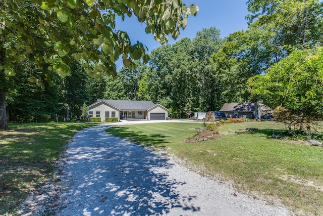 view of front facade with a garage and a front lawn