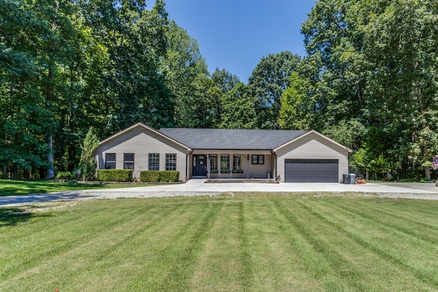 ranch-style home featuring a garage and a front yard