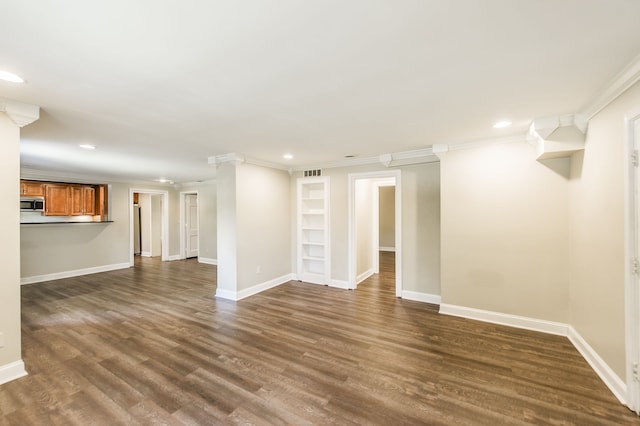 unfurnished living room with crown molding and wood-type flooring