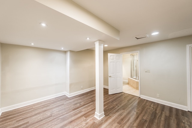 basement with wood-type flooring