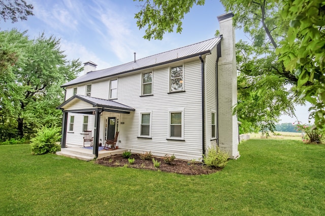 colonial inspired home with a front yard