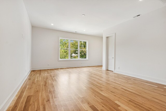 unfurnished room featuring light hardwood / wood-style flooring