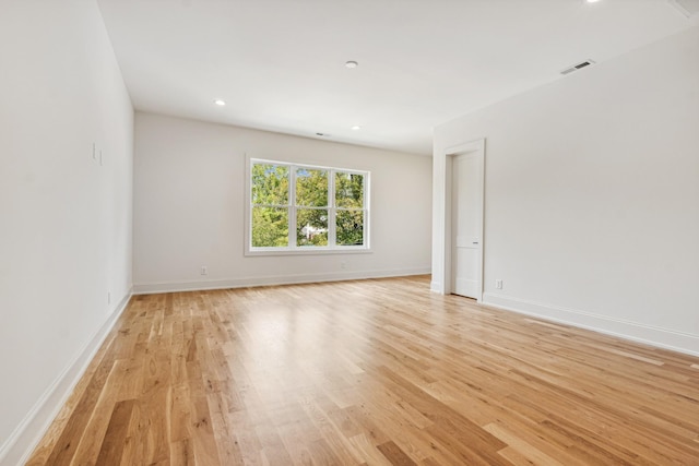 spare room featuring light wood-type flooring