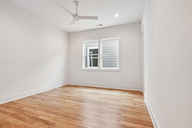 unfurnished room featuring light wood-type flooring and ceiling fan