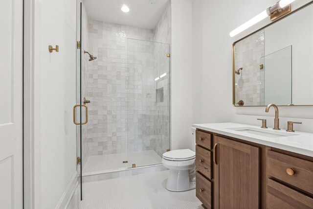 bathroom featuring walk in shower, toilet, tile patterned floors, and vanity